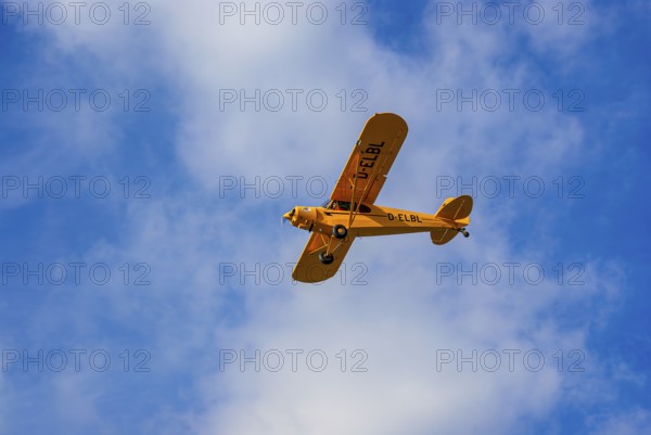 A Piper PA-18 Super Cub of the Bravo Lima Formation during a flight demonstration as part of an air show at the Rossfeld in Metzingen-Glems, Baden-Württemberg, Germany, for editorial use only