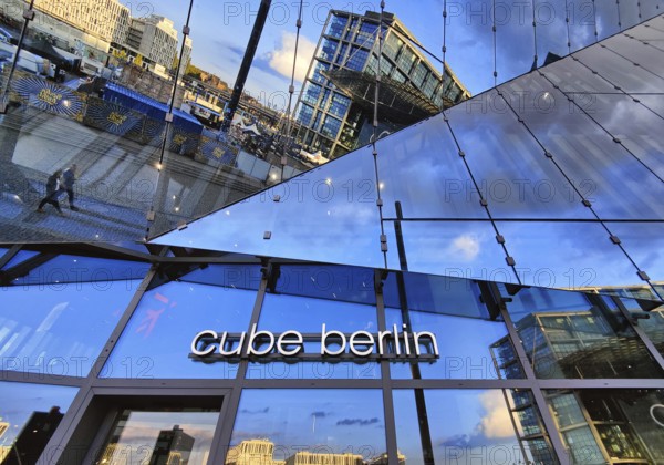 Cube Berlin, cube-shaped office building with inwardly folded glass façade reflecting the surroundings, Washingtonplatz, Berlin, Germany