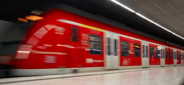 Underground arriving S-Bahn, train, class 420 in traffic red, platform, stop, station city centre, public transport, movement effect, VVS, Verkehrsverbund Stuttgart, local transport, Stuttgart, Baden-Württemberg, Germany