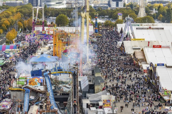 The 178th Cannstatter Volksfest on the Wasen attracted 4.2 million visitors. The Wasenrummel is one of the most important traditional festivals in Germany. In the background is the headquarters of Mercedes-Benz Group AG. Bad Cannstatt, Stuttgart, Baden-Württemberg, Germany