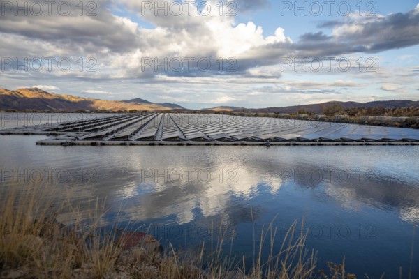 Park City, Utah - Floating solar panels provide power for Mountain Regional Water. The solar array is on the raw water storage pond at the water utility's Signal Hill Treatment Plant