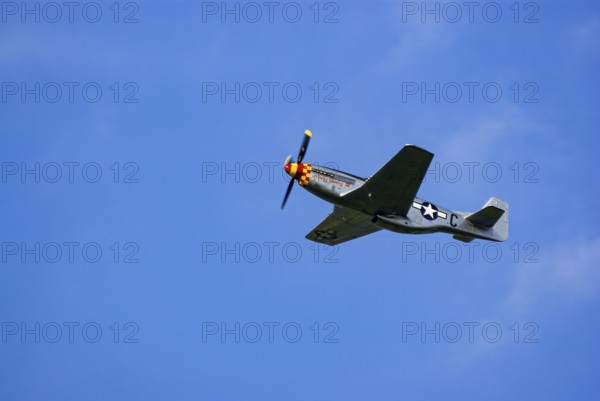 A North American P-51 Mustang of the flying group Flying Bulls, the Nooky Booky IV during an air show at the Rossfeld in Metzingen-Glems, Baden-Württemberg, Germany, for editorial use only