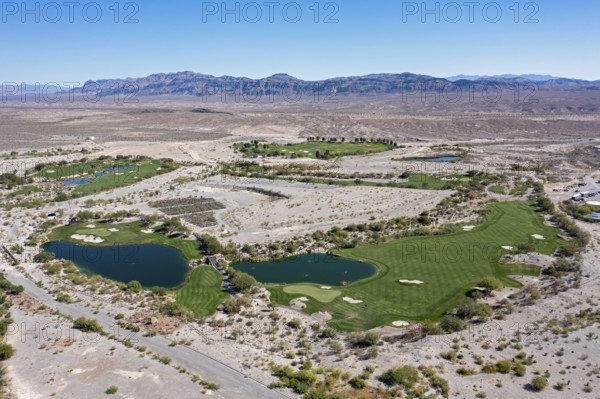 Coyote Ssprings - The Coyote Springs golf course in the Nevada desert. The Jack Nicklaus-designed course was originally to be surrounded by a planned community of 160, 000 homes. The golf course opened in 2006 but the homes were never built
