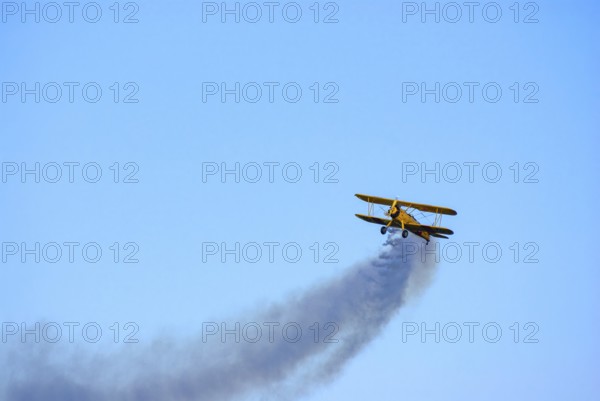 A Boeing-Stearman biplane during a flight demonstration as part of an air show at the Rossfeld in Metzingen-Glems, Baden-Württemberg, Germany, for editorial use only