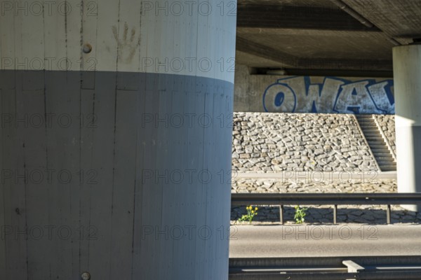 Concrete bridge with graffito in Münsingen on the Swabian Alb, Baden-Württemberg, Germany, for editorial use only