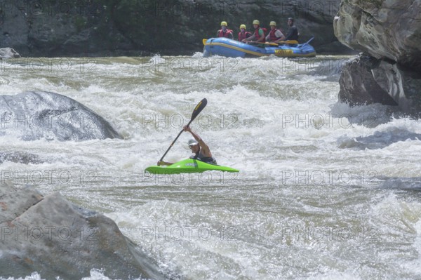 Young man kayaking in river, Costa Rica, Central America