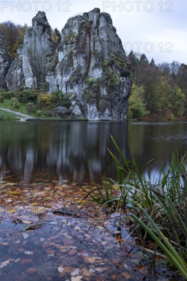 Externsteine in autumn, view over the Wiembecke pond, Teutoburg Forest, Horn-Bad Meinberg, North Rhine-Westphalia, Germany