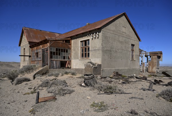 Dilapidated building in the desert sand, Pomona, restricted diamond area, near Lüderitz, Karas region, Namibia