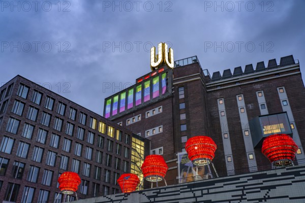 Illuminated sculptures of Dortmund roses in front of Dortmund's landmark U, Centre for Art and Creativity at dusk, Dortmund, North Rhine-Westphalia, Germany
