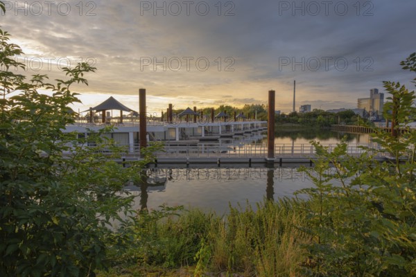 View of house messengers at Lankenauer Höft at Neustadt harbour in the evening light, Weser, Bremen, Germany