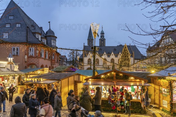 Christmas market in the old town centre of Goslar at dusk, Lower Saxony, Germany
