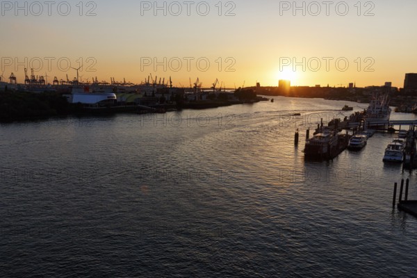 Hamburg harbour, view from the Elbphilharmonie over the Elbe at sunset, jetty, cranes of the container port on the horizon, Hamburg, Germany