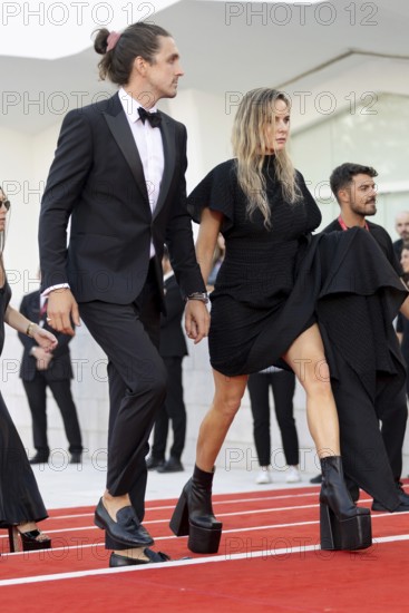 Venice, Italy - 2 September 2025: Rory St. Clair Gainer, Rebecca Ferguson during the Red Carpet of - A house of Dynamite - during the 82nd Venice International Film Festival