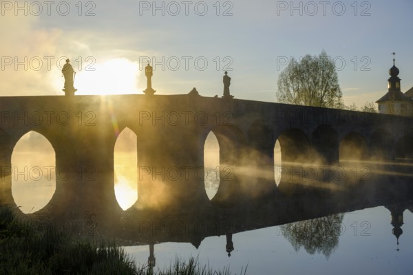 Morning atmosphere, fog at Fischhof, with historic Fischhof bridge, Tirschenreuth, Upper Palatinate, Bavaria, Germany