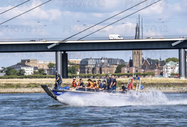 Multi-purpose boat of the THW during a training trip on the Rhine near Düsseldorf, the specialist group for water hazards, this type of boat is used to transport people and goods as a rescue boat and as a working platform, during the major exercise FÜLEX25, lasting several days, of the THW, Technical Relief Organisation, North Rhine-Westphalia regional association, over 3500 volunteers from the 127 North Rhine-Westphalia local associations practise many different deployment scenarios over 4 weekends