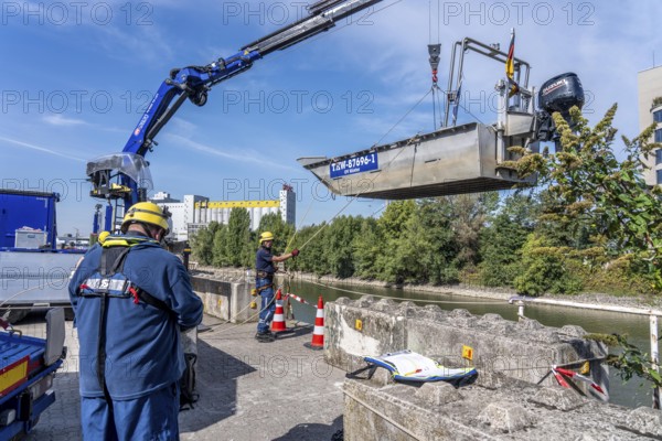 Launching, with crane, of a THW multi-purpose boat in front of a training trip on the Rhine, near Düsseldorf, of the Water Hazards Section, this type of boat is used to transport people and goods as a rescue boat and as a working platform, during the major exercise FÜLEX25, lasting several days, of the THW, Technical Relief Organisation, North Rhine-Westphalia Regional Association, over 3500 volunteers from the 127 North Rhine-Westphalia local associations practise many different deployment scenarios over 4 weekends