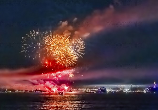 Lake Night Festival Constance. Water fireworks over the German shore and the neighbouring Swiss town of Kreuzlingen. View of the fireworks from Lake Constance. Constance, Baden-Württemberg, Germany