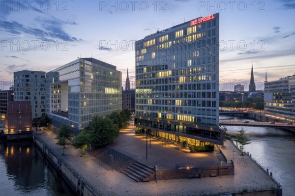 Aerial view of the Spiegel building at Ericusspitze in Hamburg's HafenCity in the Brooktorkai neighbourhood at blue hour, Hamburg, Germany