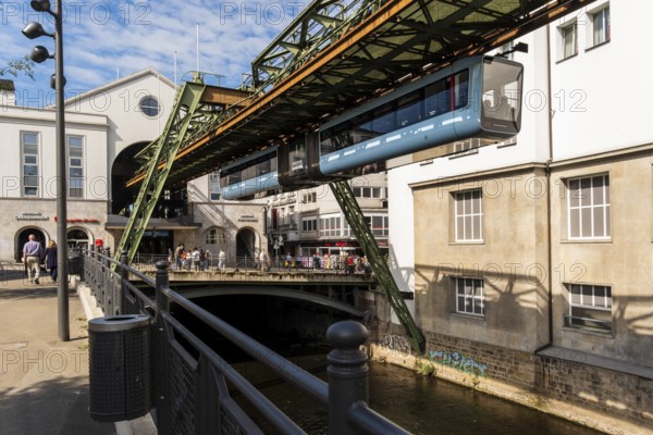 The Wuppertal suspension railway arrives at the Döppersberg stop in the city centre of Wuppertal, Germany