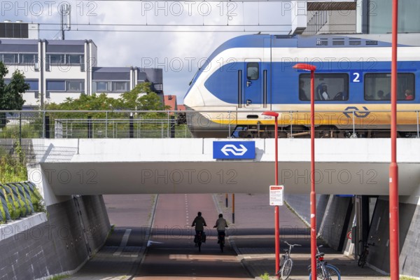 Cycle path in the east of Utrecht, subway of the railway line, at Utrecht-Lunetten station, Maarschalkerweerdpads, inner-city cycle path, wide, part of a cycle path network, Netherlands