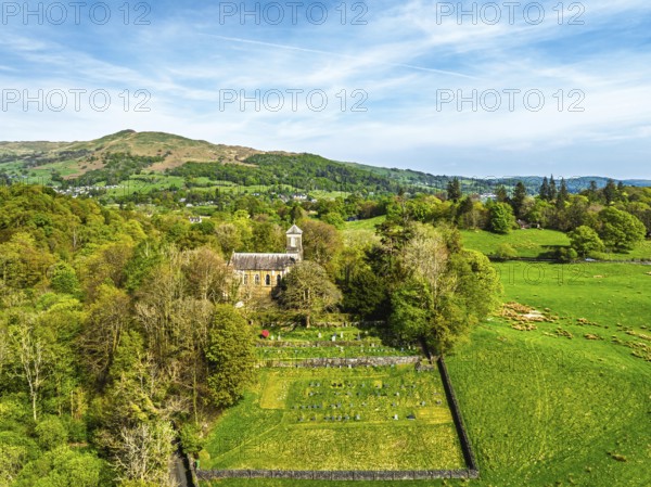 Holy Trinity Church from a drone, Bog Lane, Brathay village, Lake District, Cumbria, England, United Kingdom