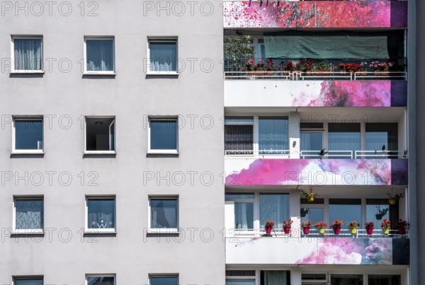 High-rise residential building, in Essen-Steele, with colourfully designed façade, balcony balustrades, after renovation, North Rhine-Westphalia, Germany