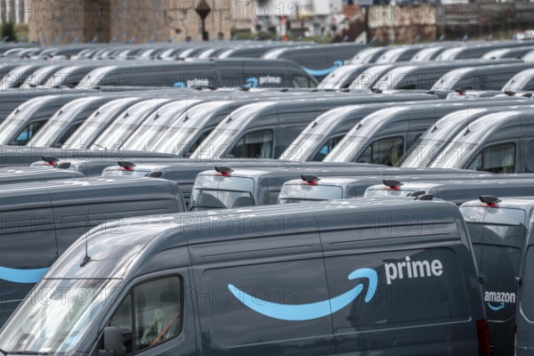 New delivery vehicles for the online mail order company Amazon Prime, with electric drive, are waiting for delivery in the inland port of Duisburg, Duisport, North Rhine-Westphalia, Germany
