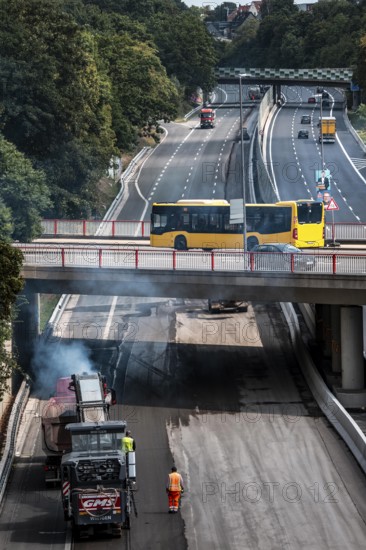 Rehabilitation of the A52 motorway near Essen, an 8 km long section between the Essen-Kettwig junction and the Essen-Ost motorway junction will be completely renovated over a period of 9 years, 6 lanes, new drainage pipes, carriageway, bridges, noise barriers, traffic facilities, here the last section, direction Düsseldorf, new carriageway surface, laying of porous asphalt, here the removal, milling, of the old carriageway in front of the application of the new whispering asphalt, Essen, North Rhine-Westphalia, Germany
