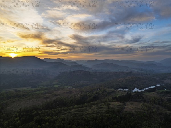Sunset over Mountains and Coniston Water from drone, Lake District National Park, Cumbria, England, United Kingdom