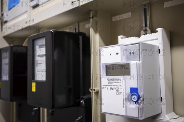 Various rotary electricity meters in a control cabinet in Wuppertal, Germany, digitally reworked