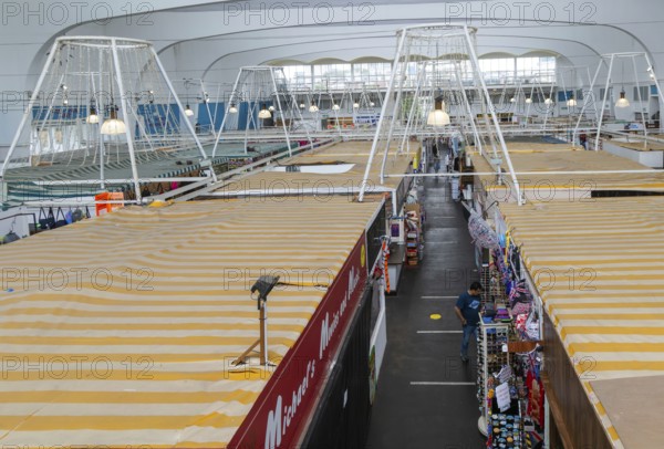 Raised view over roofs of market stalls in Market Building or Pannier Market, city of Plymouth, Devon, England, UK