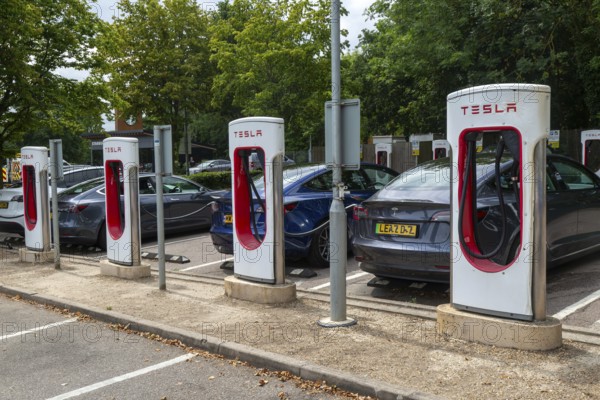 Charging point facility for Tesla electric vehicles at service station, M25 South Mimms services, Hertfordshire, England, UK