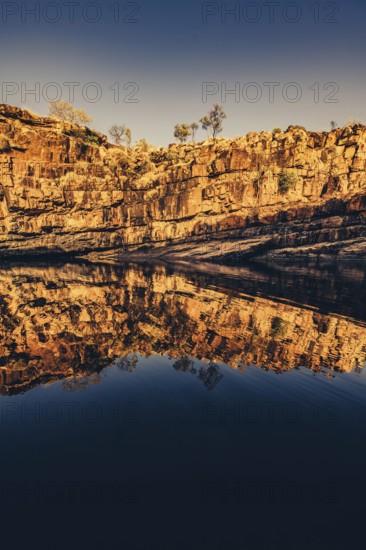 Bell Gorge waterfall, a body of water in north-west Australia in the Kimberley. Sunrise in the outback, Australia