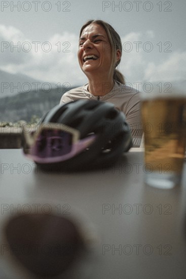 Young woman riding a racing bike on Lake Garda. Sunny weather and dolce vita