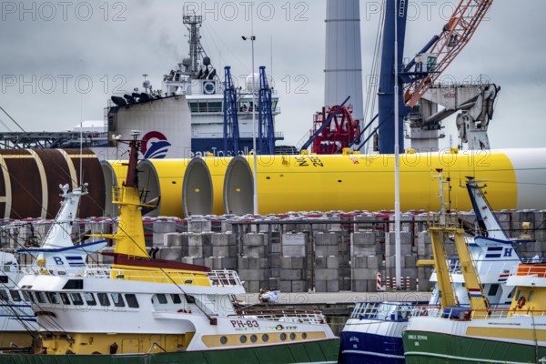 The seaport of Eemshaven, Julianahaven Basin, where the foundation structures, monopiles, for offshore wind farms are stored, which then support the actual wind turbines, the components are transported to the wind farms in the North Sea on large workboats and anchored to the seabed, where the wind turbines are then built, Eemshaven, Netherlands
