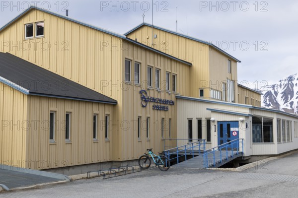Hospital, yellow wooden house, Longyearbyen, Spitsbergen, Svalbard