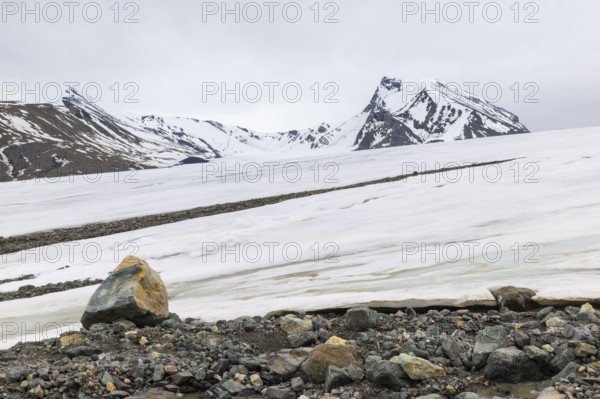 Melting glacier, stones, water, Cooper Camp, Spitsbergen, Svalbard