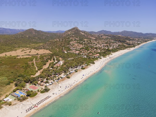 White sandy beaches and turquoise-blue sea stretch for several kilometres on the Costa Rei, a stretch of coastline on the Italian Mediterranean island of Sardinia, making the area one of the most popular holiday destinations in Europe. (Aerial view with a drone), Monte Nai, Costa Rei, Sardinia, Italy