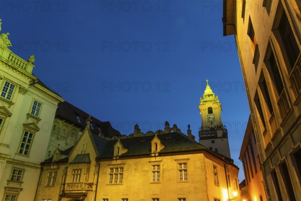 Night shot of Primitial Square with New and Old Town Hall and Primitial Palace in the historic centre of Bratislava, Slovakia
