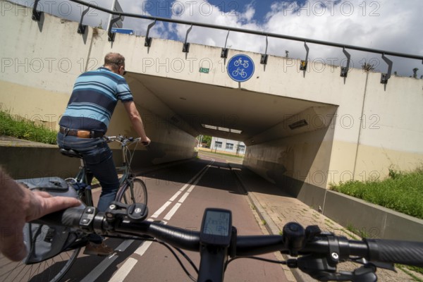 Roundabout in the Dutch city of Houten, the lanes for cars and bicycles are separated, the cycle path runs under the car lane, through subways, so that cyclists and cars can pass the intersection separately, in Houten, bicycle traffic has priority, considered a model city for modern bicycle traffic, Netherlands