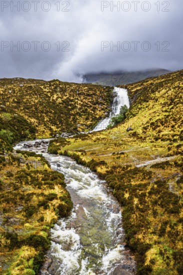 Eas a' Bhradain waterfall, Red Cuillin mountains, Loch Ainort, Isle of Skye, Scotland, UK