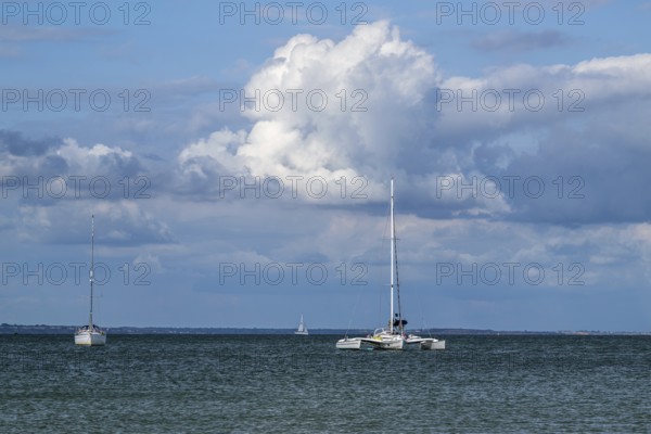 Boats on sea over Knoll Beach Studland, Poole, Dorset, England, United Kingdom