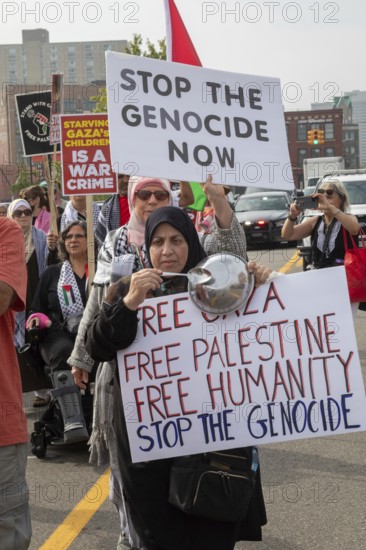 Detroit, Michigan USA - 26 July 2025 - Protesters rally at Eastern Market, banging empty pots to protest starvation in Gaza