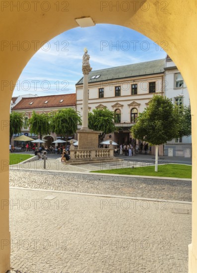 Alley with a view of the square and the Plague Column in the historic centre of the Capital of Culture 2026, Trencín, Slovakia