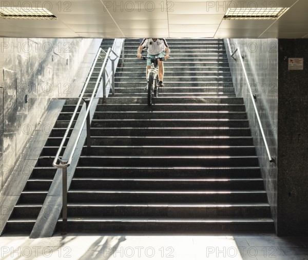 A cyclist descends a staircase on a mountain bike, Capital of Culture 2026, Trencín, Slovakia
