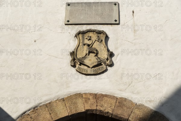 Old relief of the city coat of arms on the city tower of the Capital of Culture 2026, Trencín, Slovakia