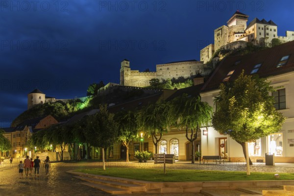 Night shot of the Peace Square in the historic centre of Trencín, Trencín Castle in the background, Capital of Culture 2026, Trencín, Slovakia