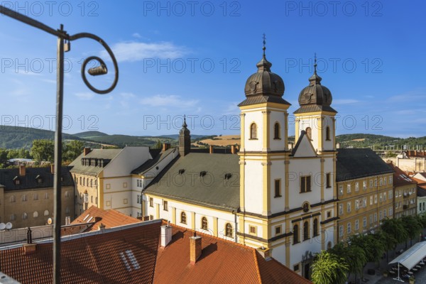 View from the city tower of the Piarist Church of St Francis Xavier and the old town in the evening light, Capital of Culture 2026, Trencín, Slovakia