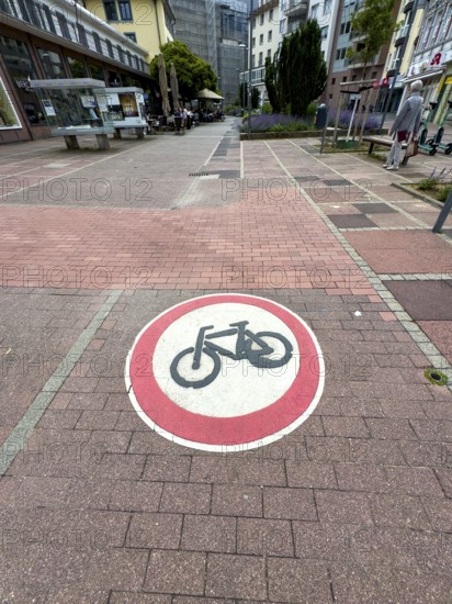 Official traffic sign painted on cobblestones in pedestrian zone Use of passage forbidden for bicycles, Aachen, North Rhine-Westphalia, Germany