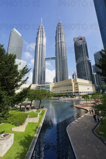 Petronas twin towers and Symphony Lake in KLCC park, Kuala Lumpur, Malaysia, Asia